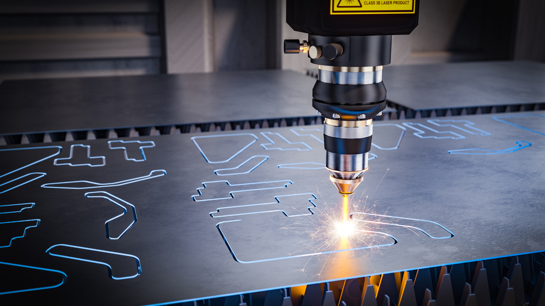 A machine is cutting a piece of metal with a laser.