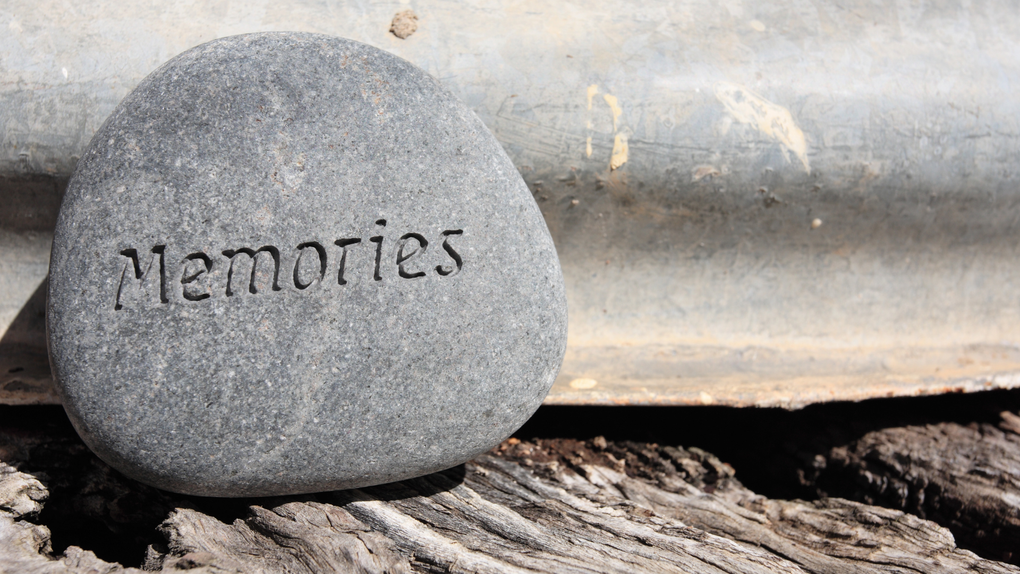 A rock with the word memories written on it