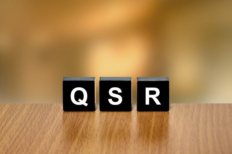 3 black blocks with the letters QSR