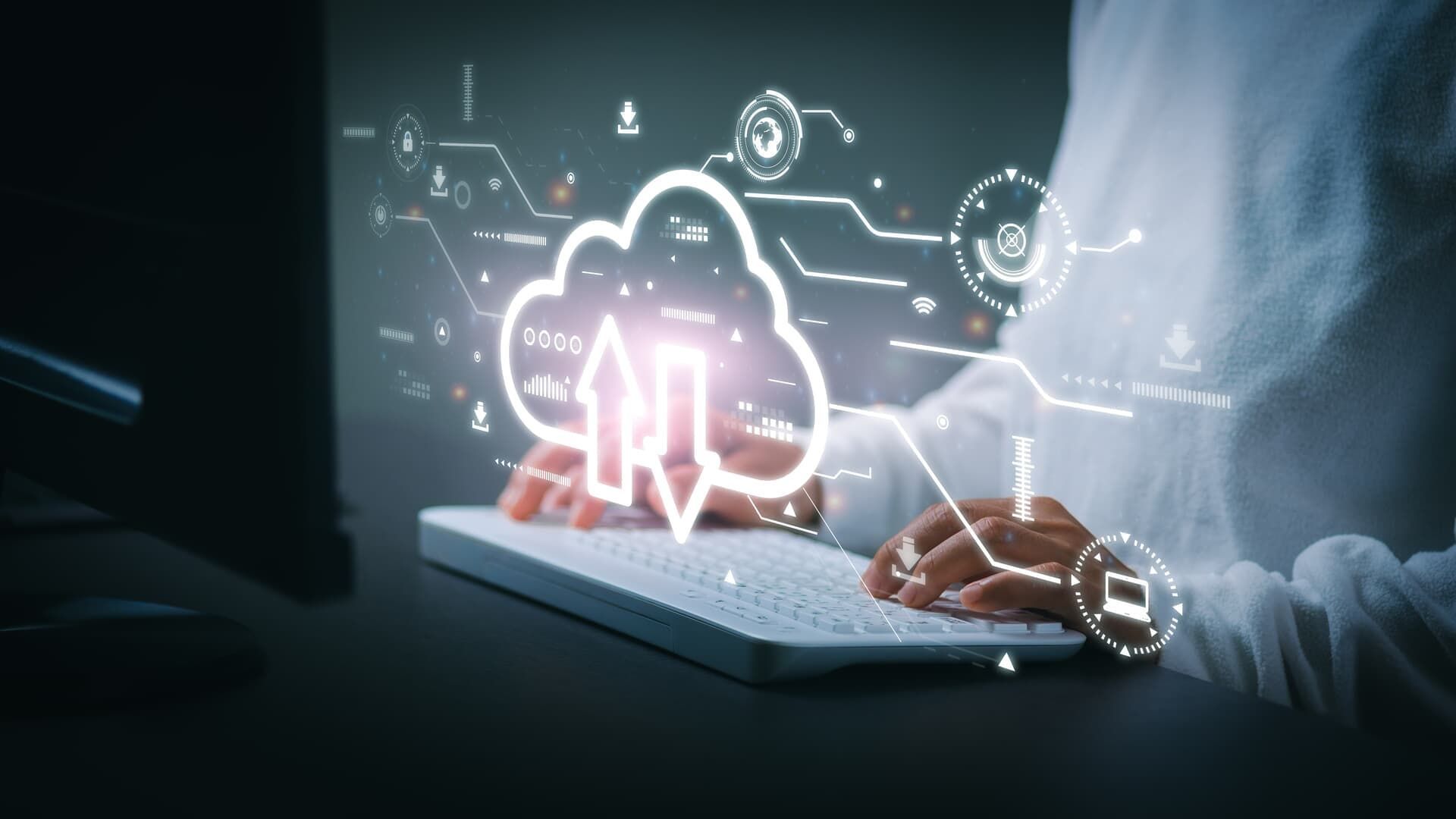 Person typing on keyboard, cloud icon with arrows, digital network overlay.