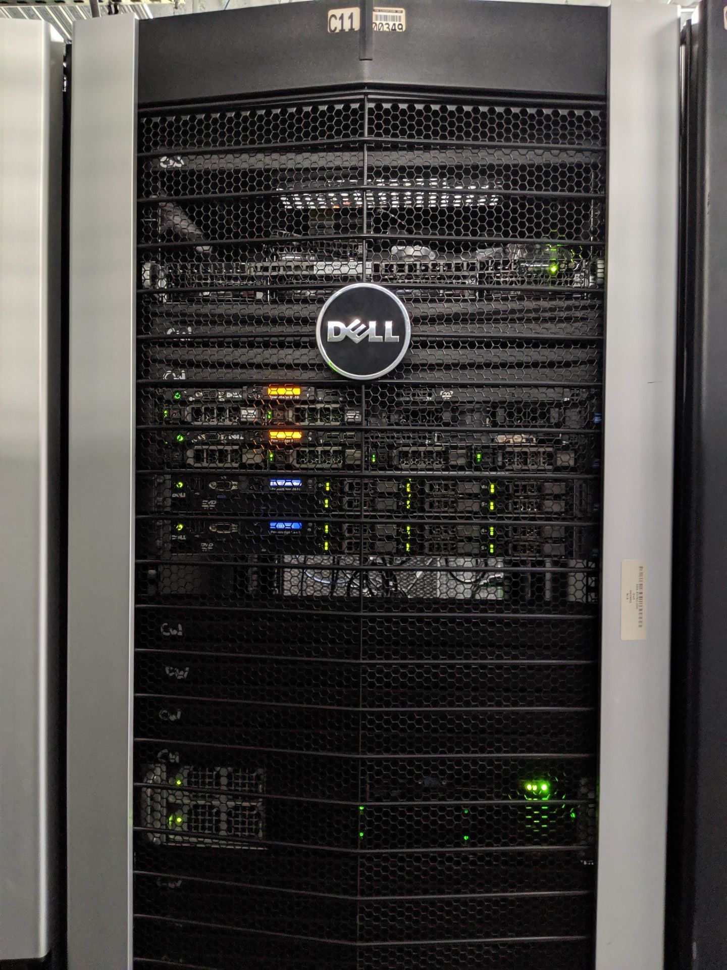 Dell server rack with a black front and lights.