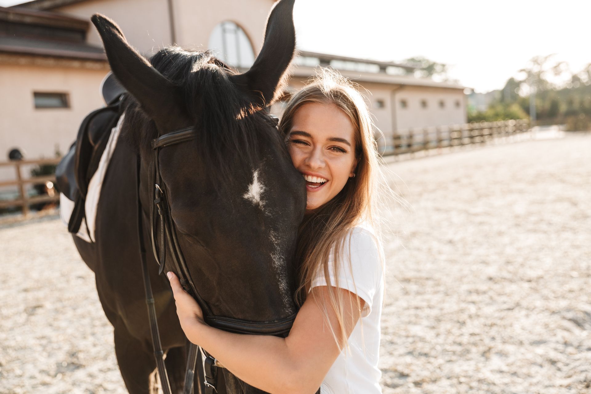 Woman hugging a horse during equine-assisted therapy