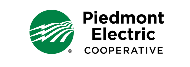 The piedmont electric cooperative logo is a green circle with a lightning bolt in the middle.