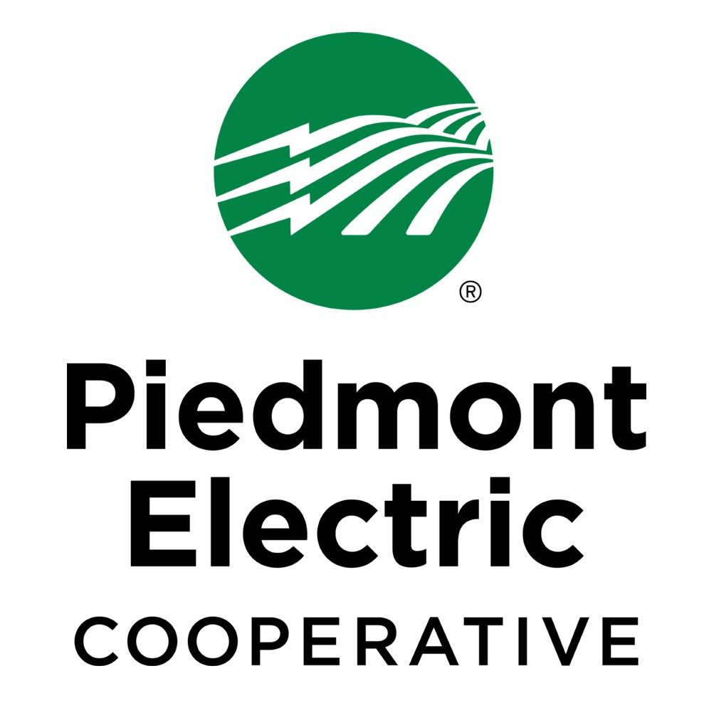 The piedmont electric cooperative logo is green and black