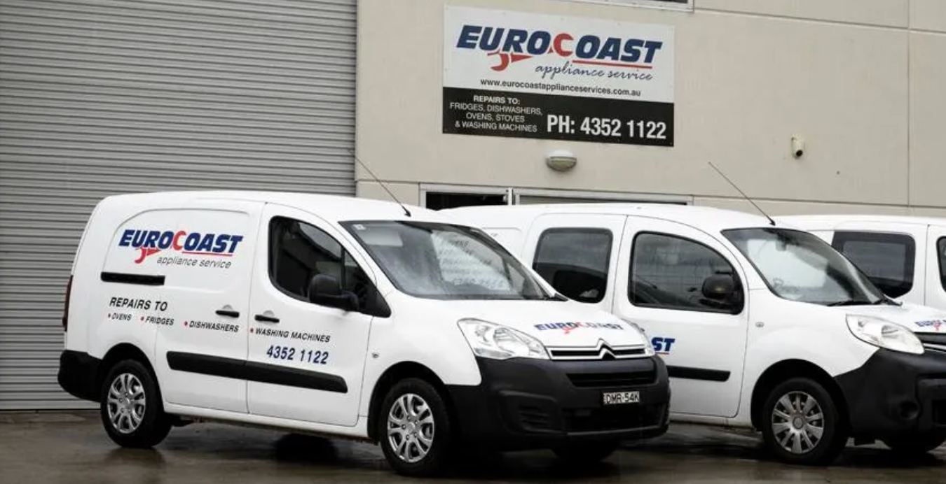 Three white vans larked side by side in front of the EuroCoast office.