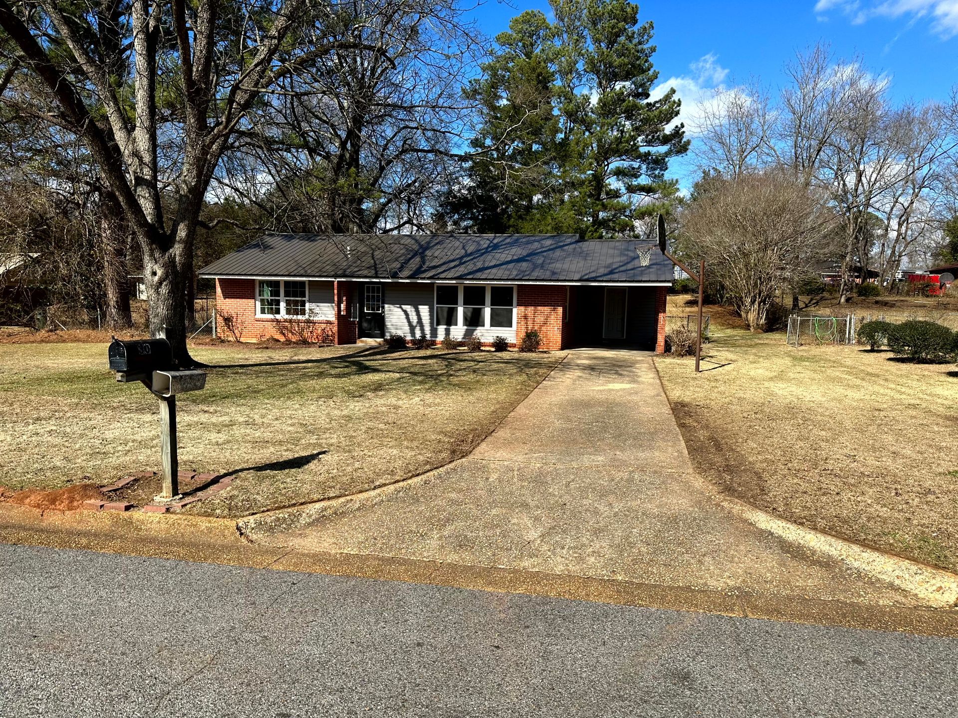 Single-family home with a farmhouse-style exterior, a wide front porch