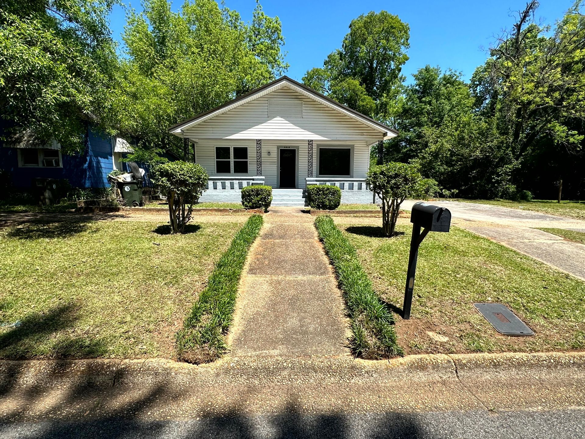 Single-family home with a modern  exterior, a wide front porch
