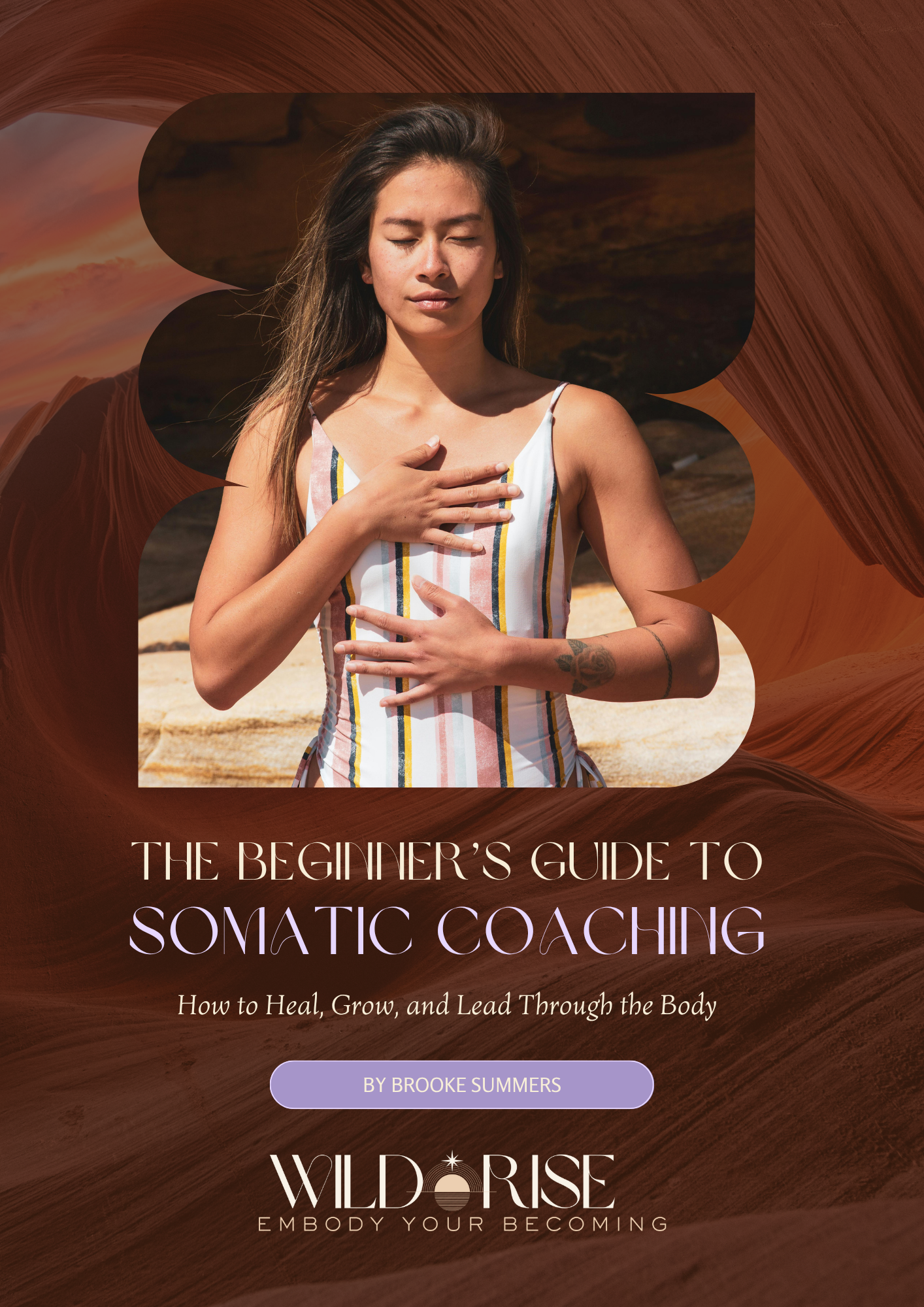 woman seated in the desert with hands on heart and belly