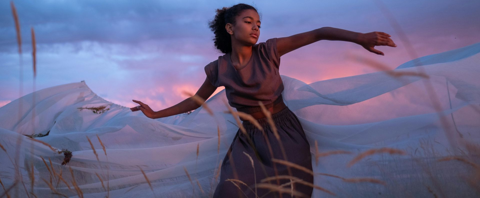 woman dancing in sunset dreamily