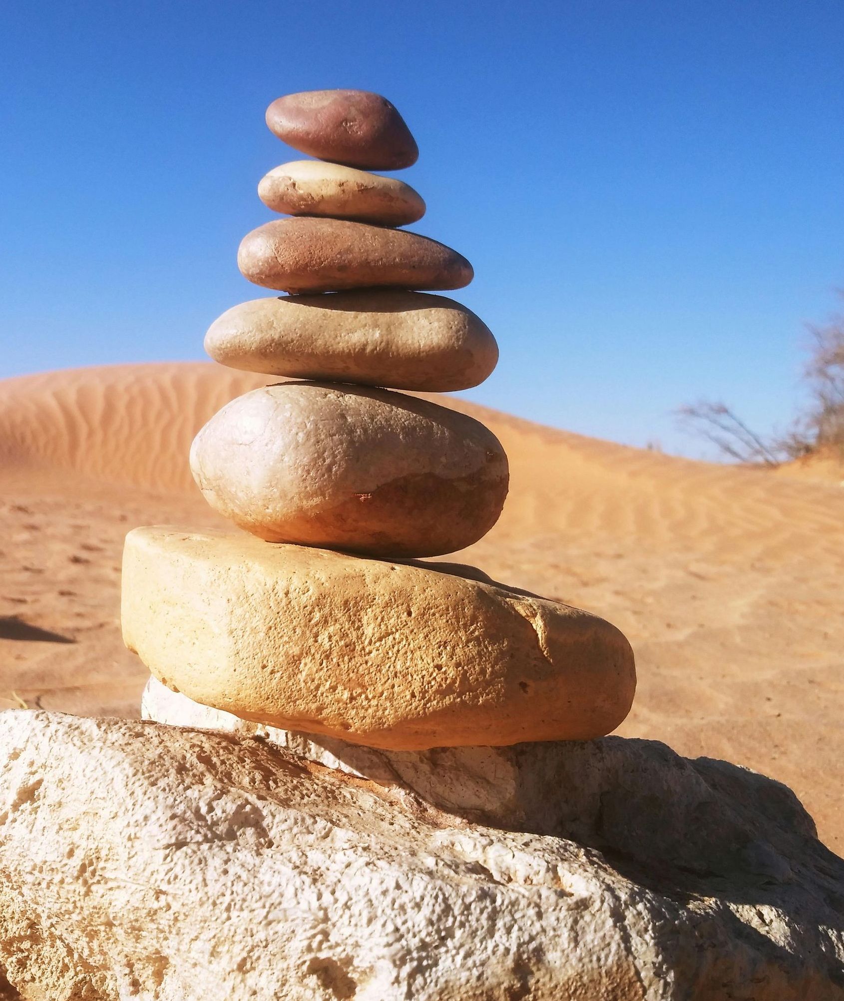 A pile of rocks stacked on top of each other in the desert