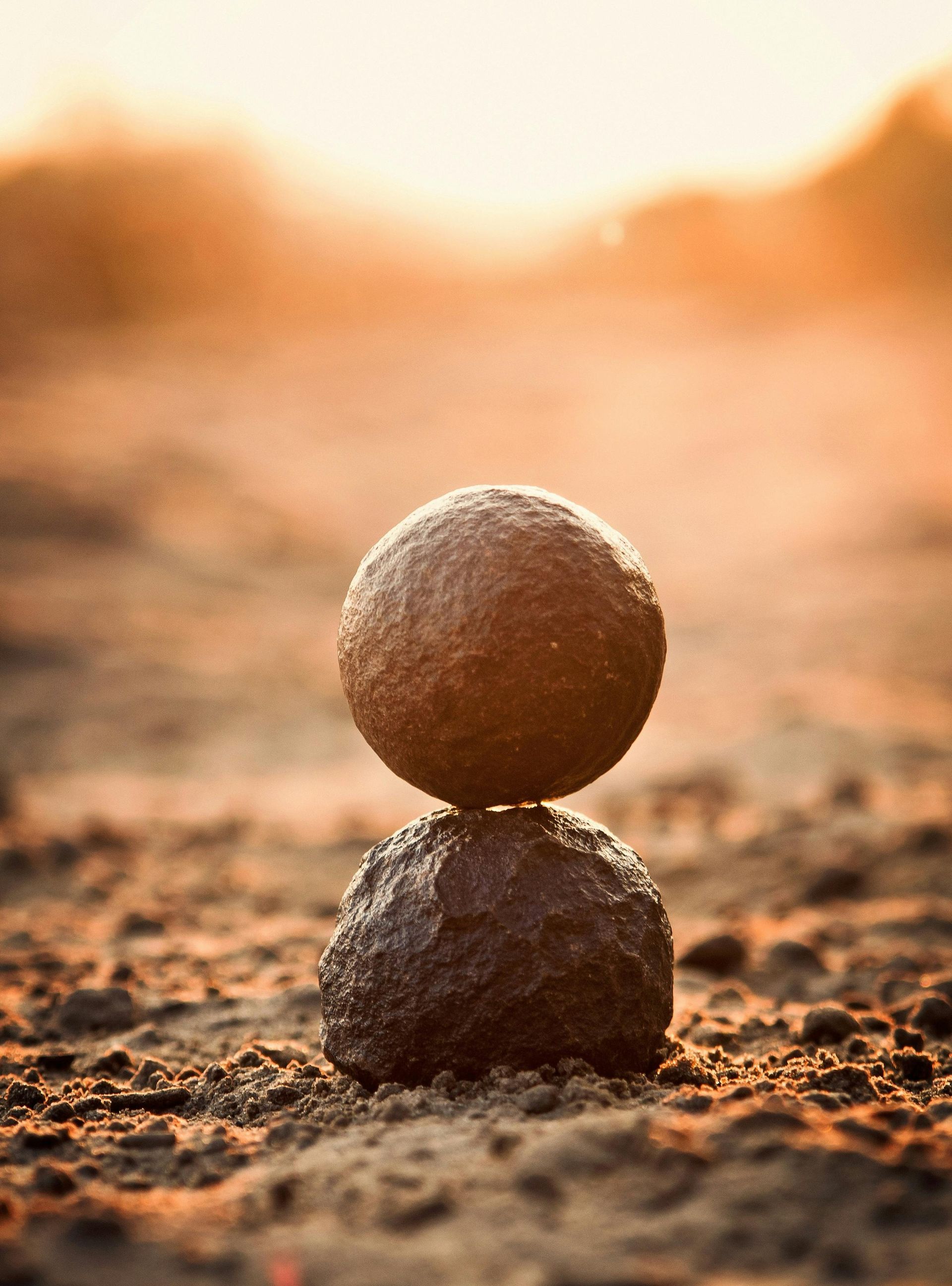 A pile of rocks stacked on top of each other on the ground.