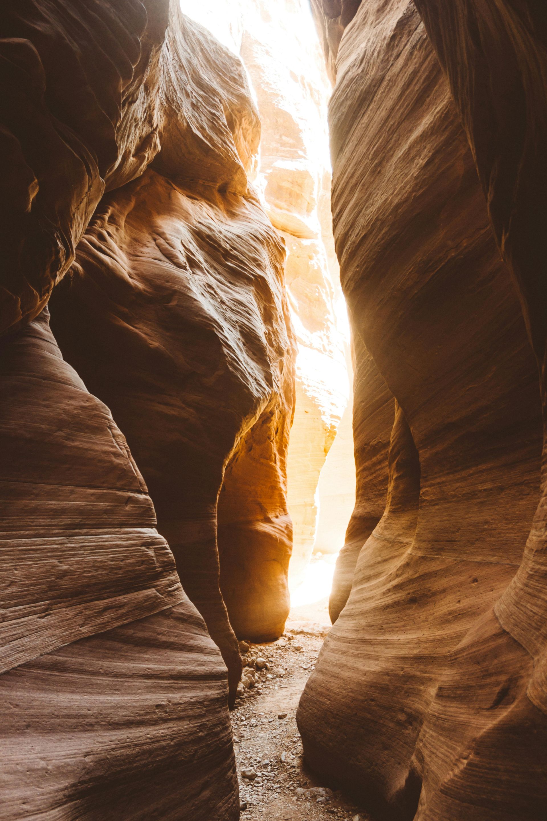 A canyon with a light coming out of the middle of it.