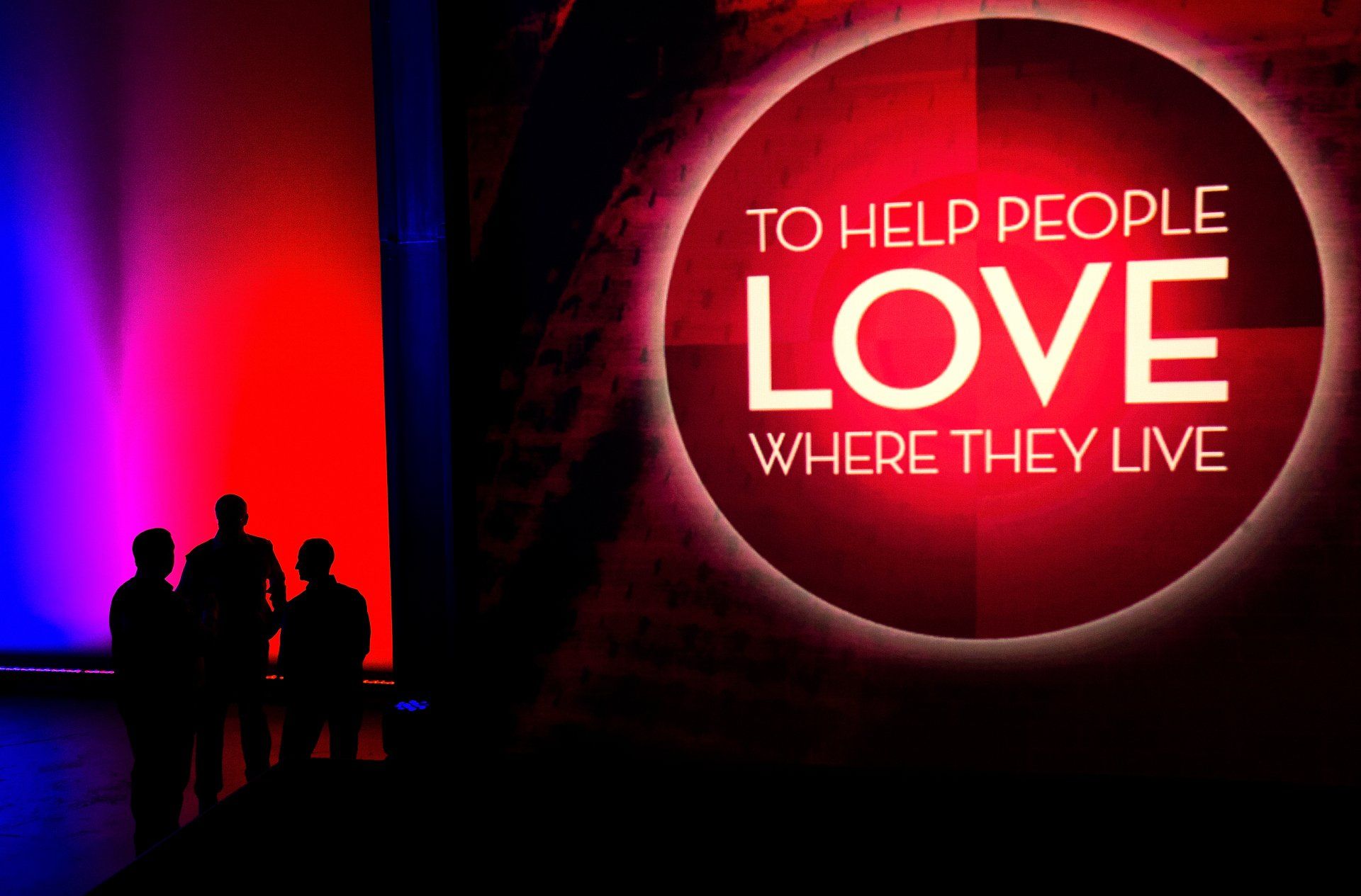 sign on stage at corporate event reads,