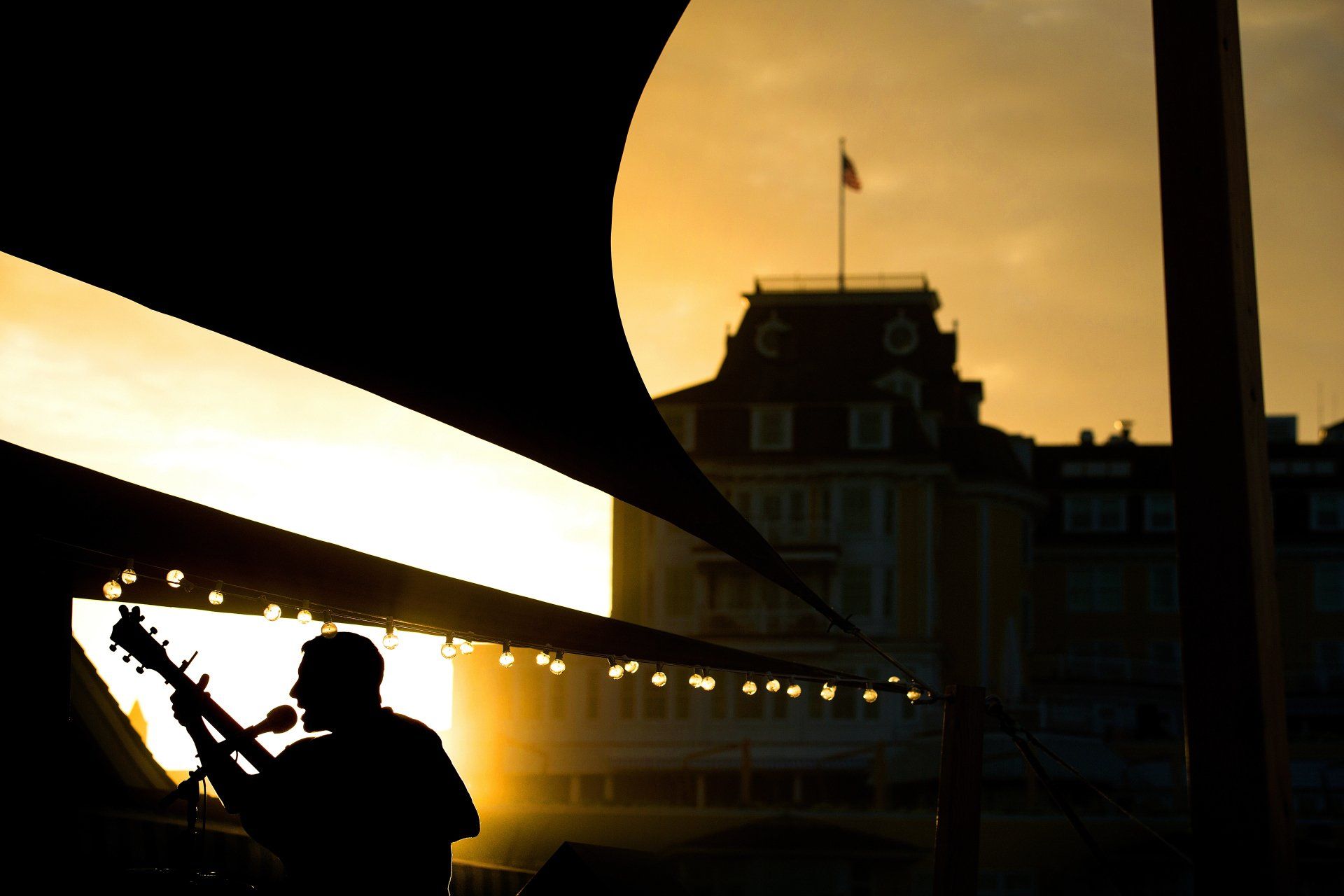 Women pose in face statues during a company getaway trip