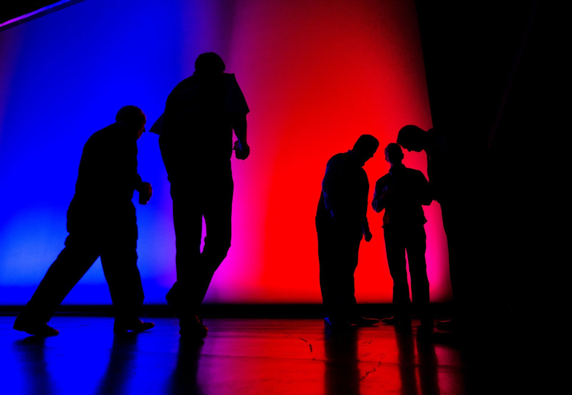 people work on stage doing an executive event