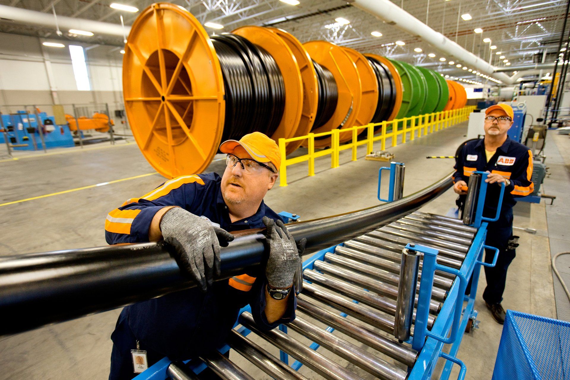 Man working with cables in a manufacturing plant