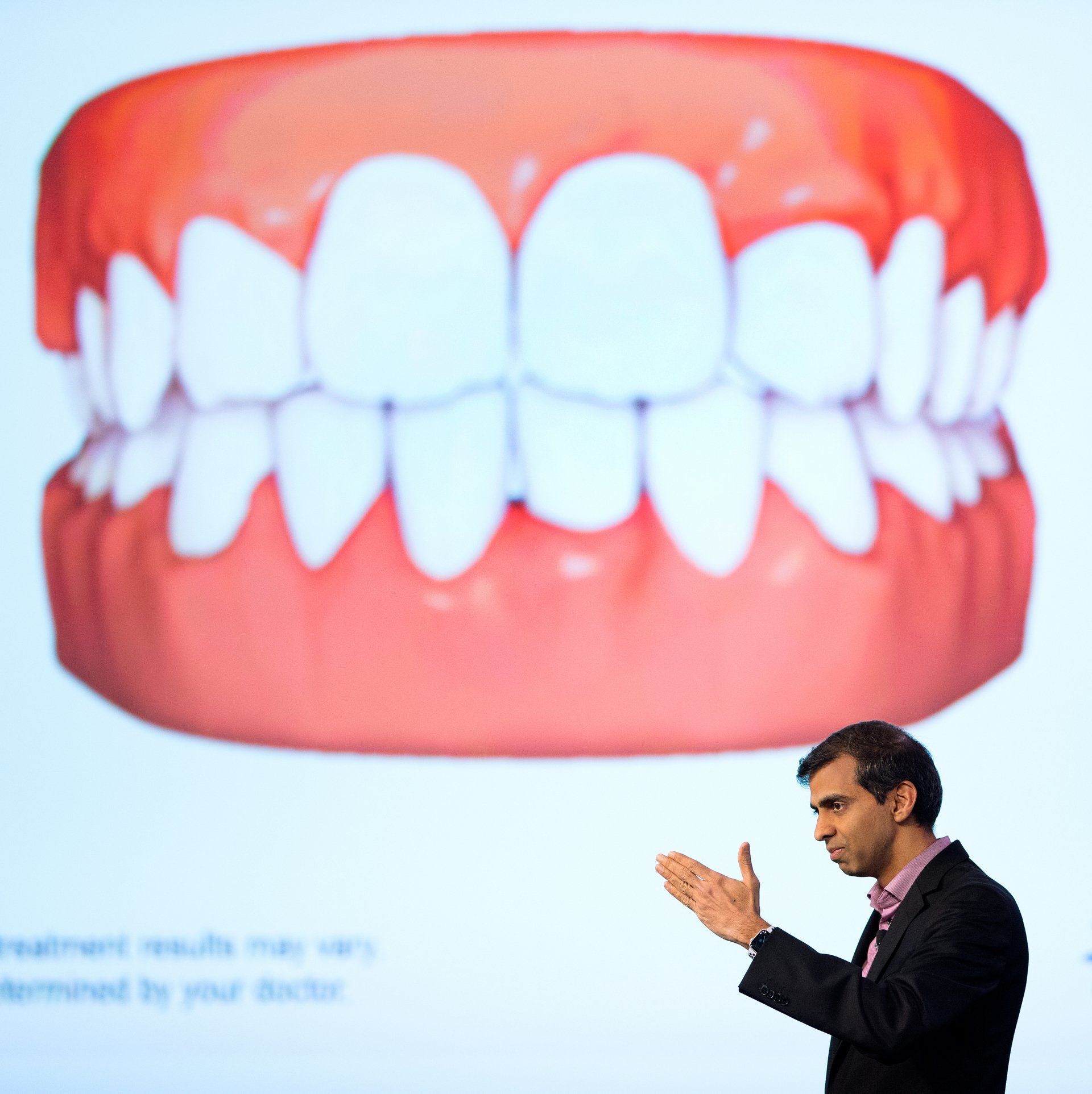 Company speaker smiles at special corporate event