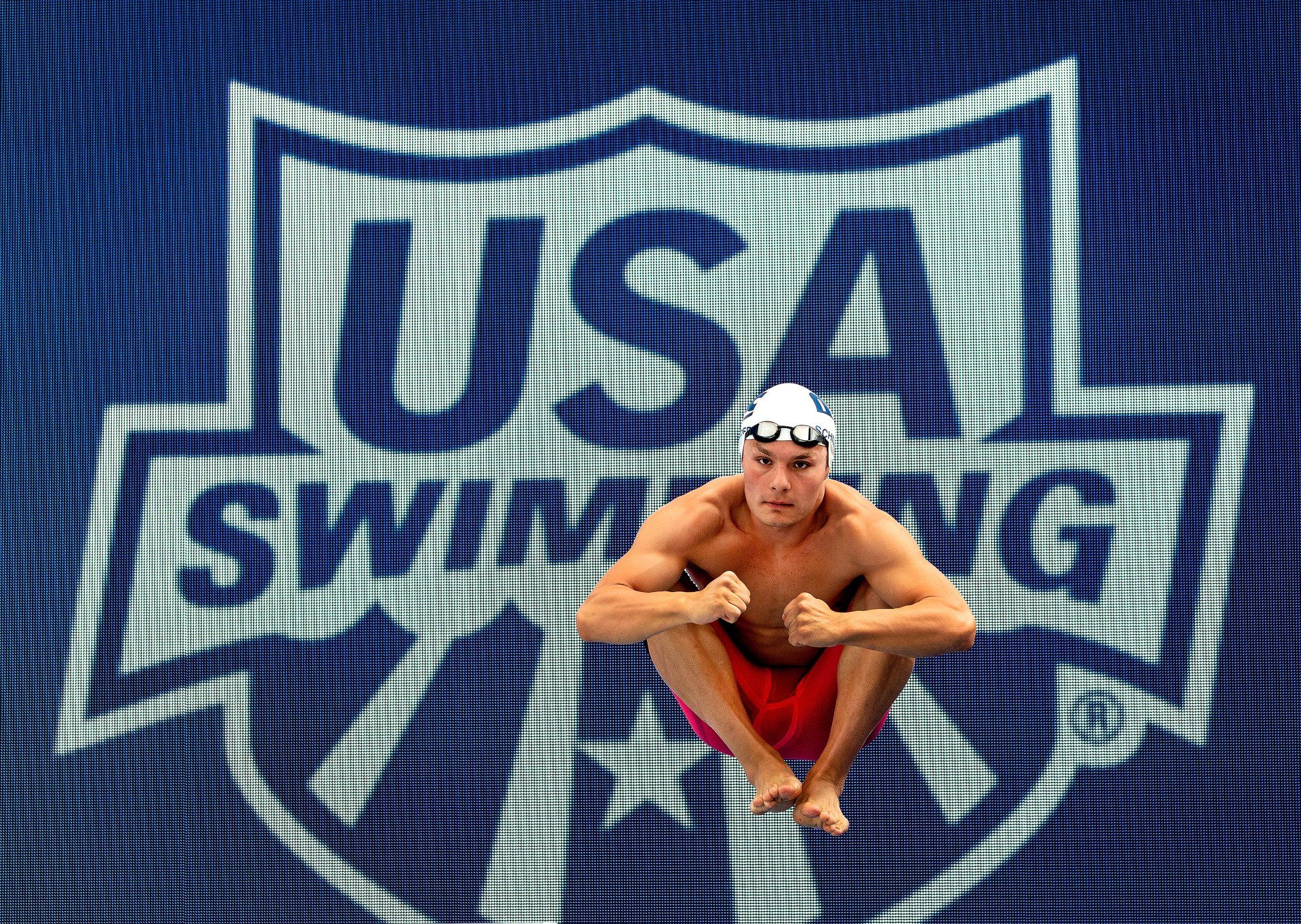 a diver flips at the USA Swimming Jr. Nationals