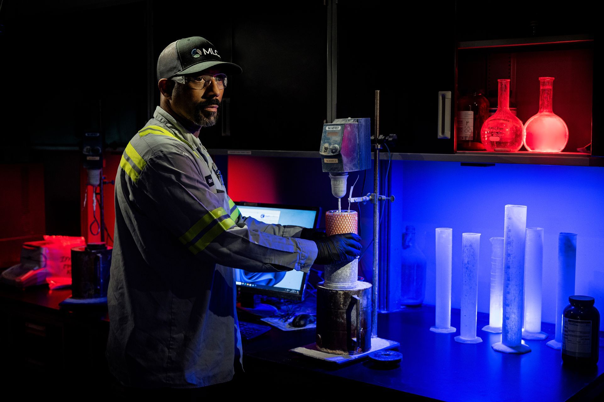 Industrial worker operating CNC machinery in heavy manufacturing facility, demonstrating precision metalworking processes.
