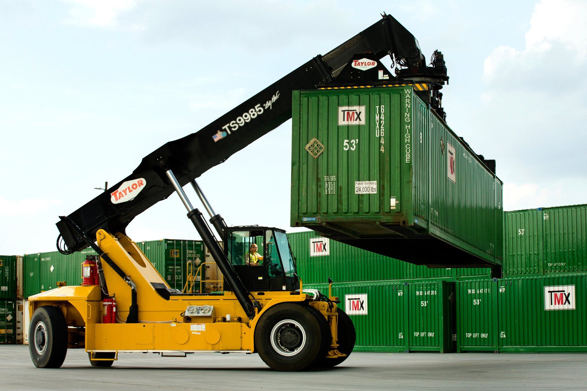 cargo container is moved at a transportation facility