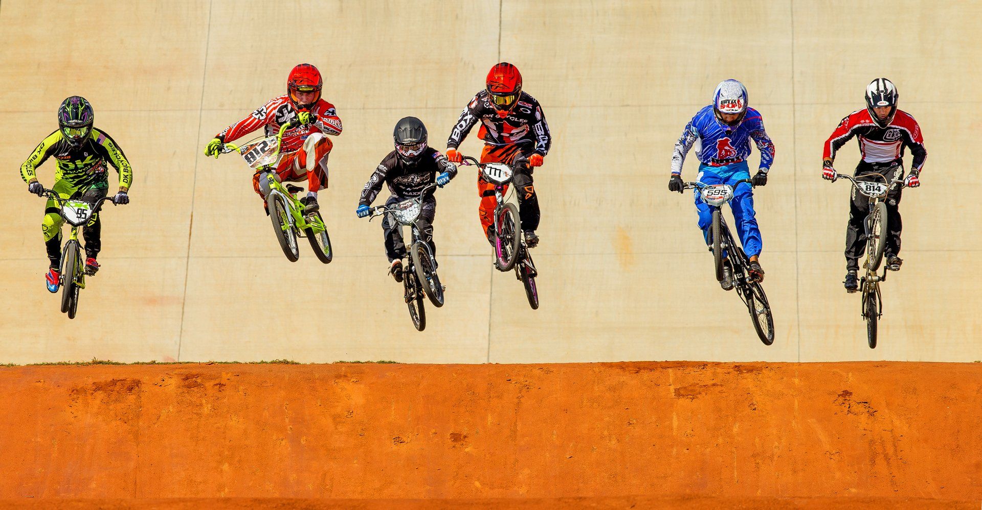 Racers jump during a Community hospital Novant Health's BMX event
