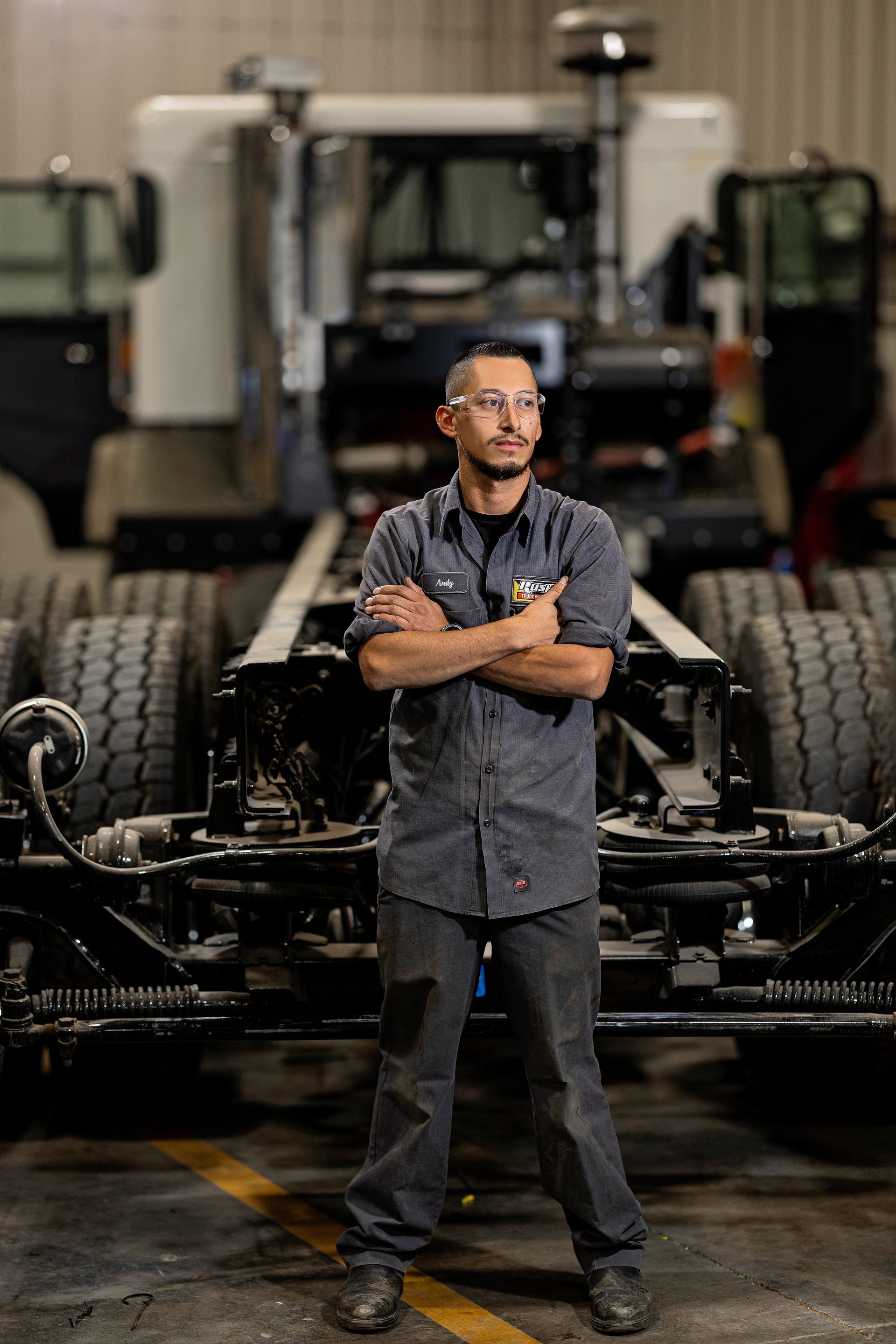 Production line supervisor managing automated assembly processes in manufacturing facility.