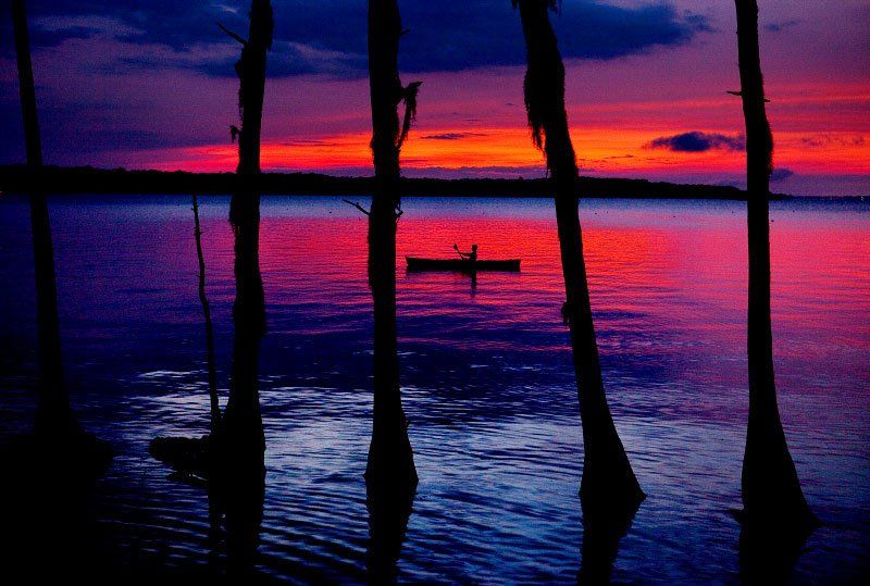 scenic image of kayak at sunset