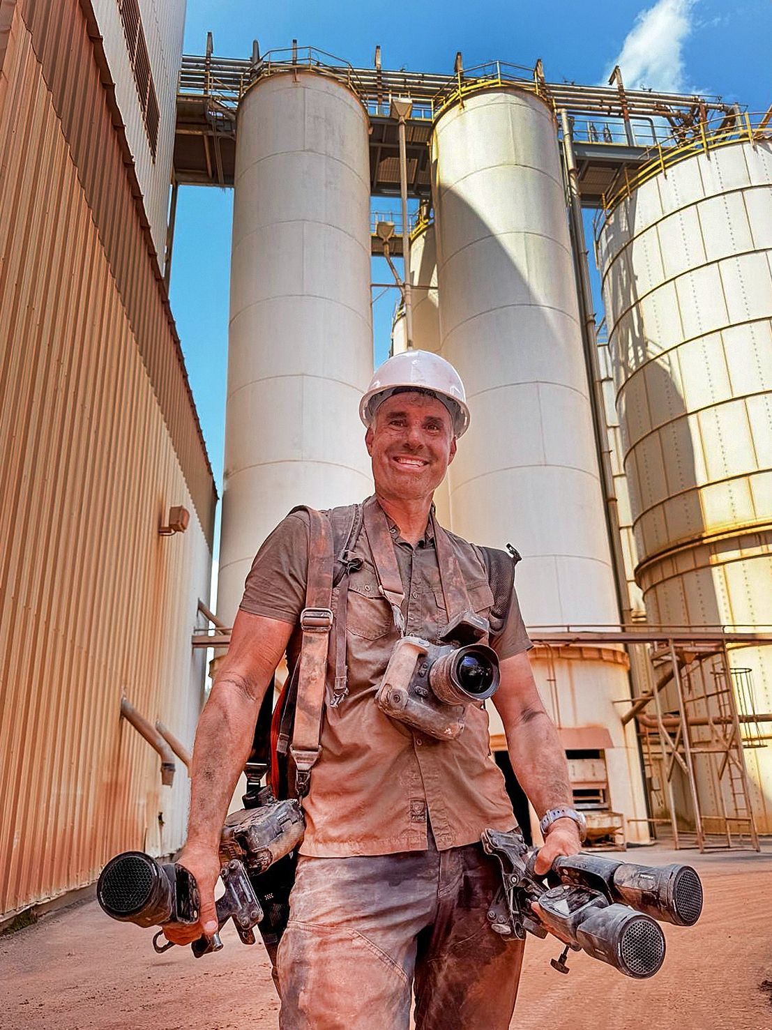 Getting up close means getting dirty - our photographers embrace the dust, heat, and challenging conditions to document real industrial work. This image shows photographer Patrick Schneider shortly after exiting a ceramics manufacturing facility.