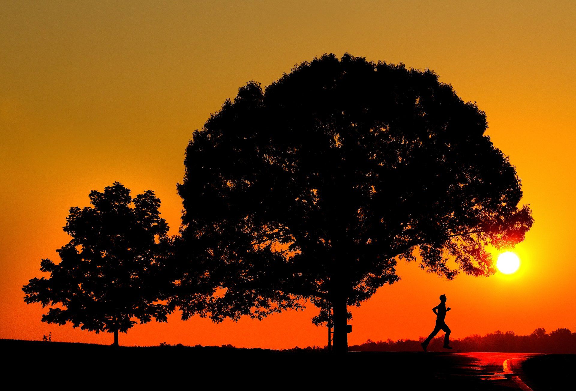 dramatic on-location photograph or a jogger at sunrise