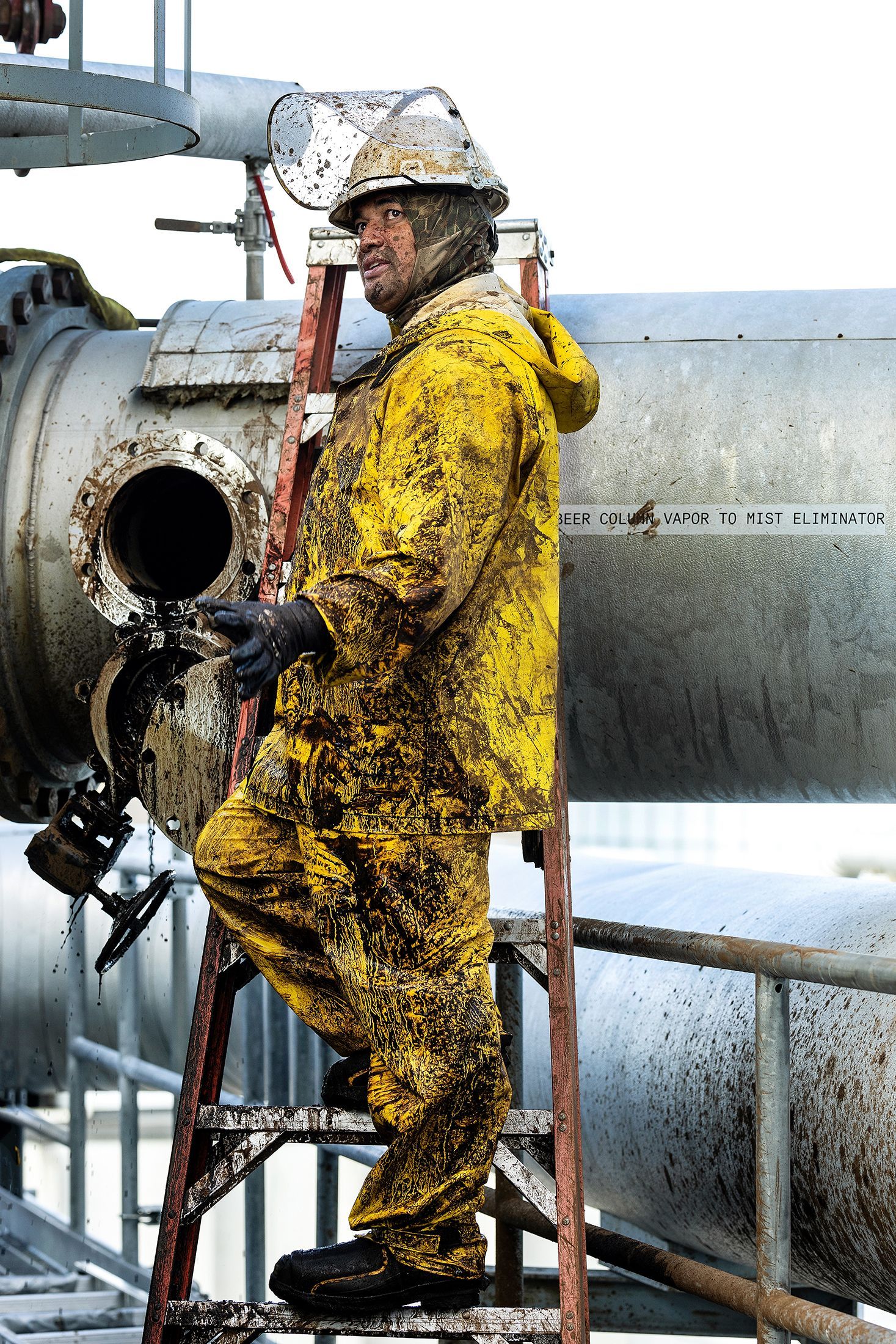 Industrial maintenance technician after completing heavy manufacturing facility repairs, showcasing authentic working conditions in industrial environments.
