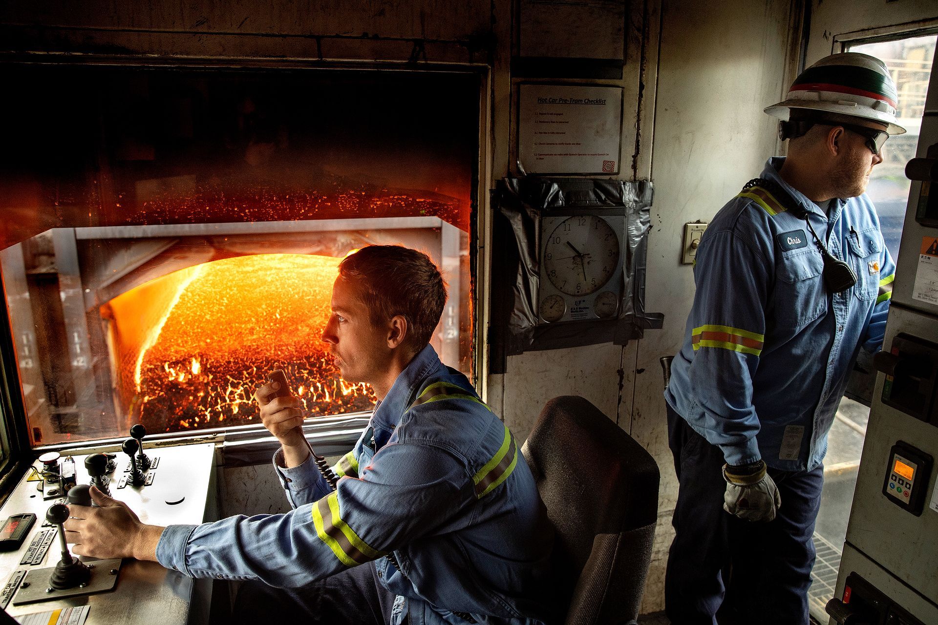 Factory floor operator managing automated systems.