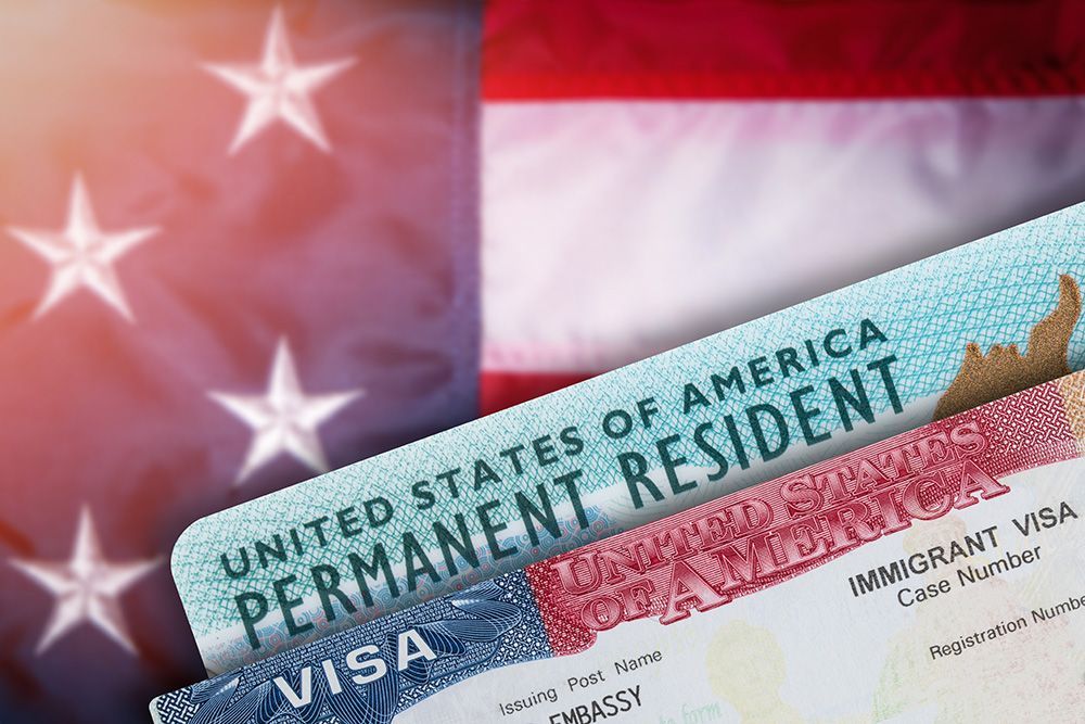 A united states of america permanent resident visa with an american flag in the background.