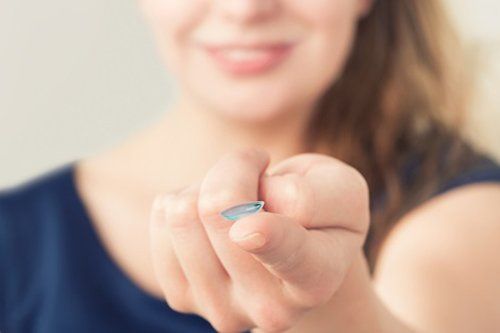 Woman inserting a contact lens in eye. : Stock Photo View similar imagesMore from this photographer Woman inserting a contact lens in eye