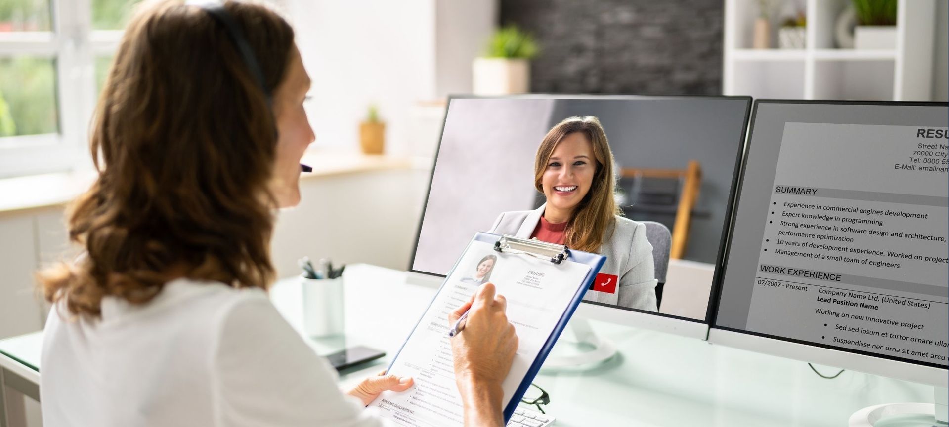 A person is using a laptop computer to have a video call with a group of people.