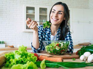 Woman Eating Vegetables — Broadview Heights, OH — Healthy One Weight Loss