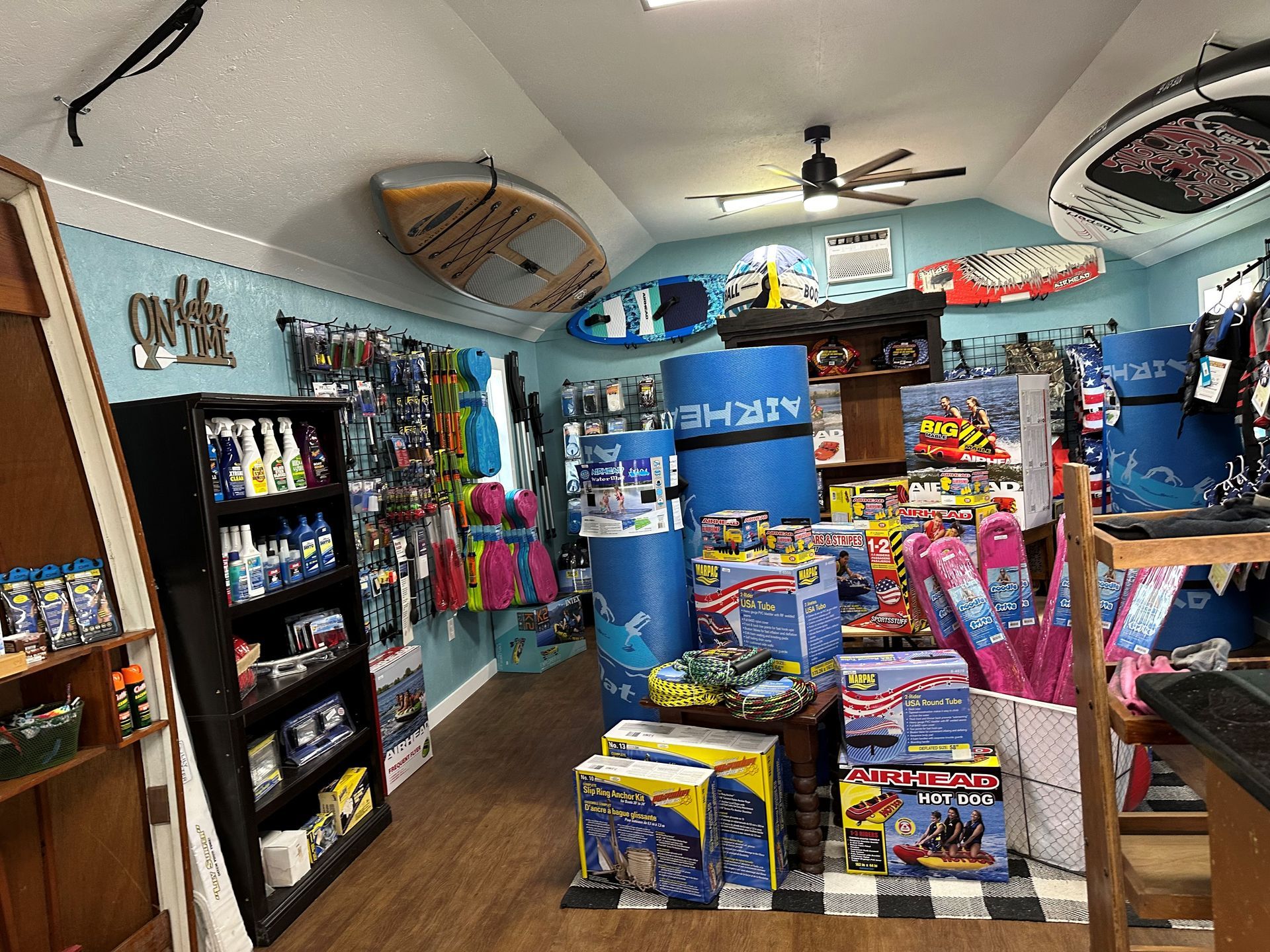 A store filled with lots of toys and surfboards.