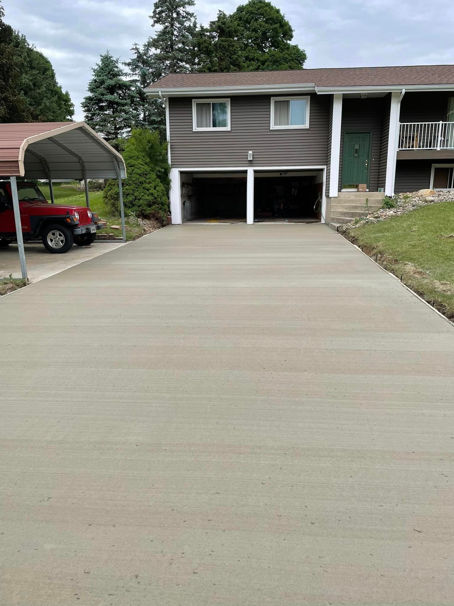 A blue house with a swimming pool in the backyard.
