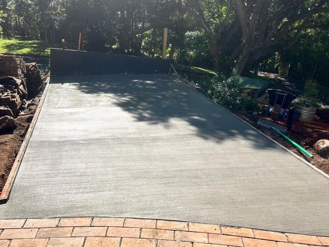 A Concrete Driveway Next to a Brick Floor — ZBM Constructions in Alstonville, NSW
