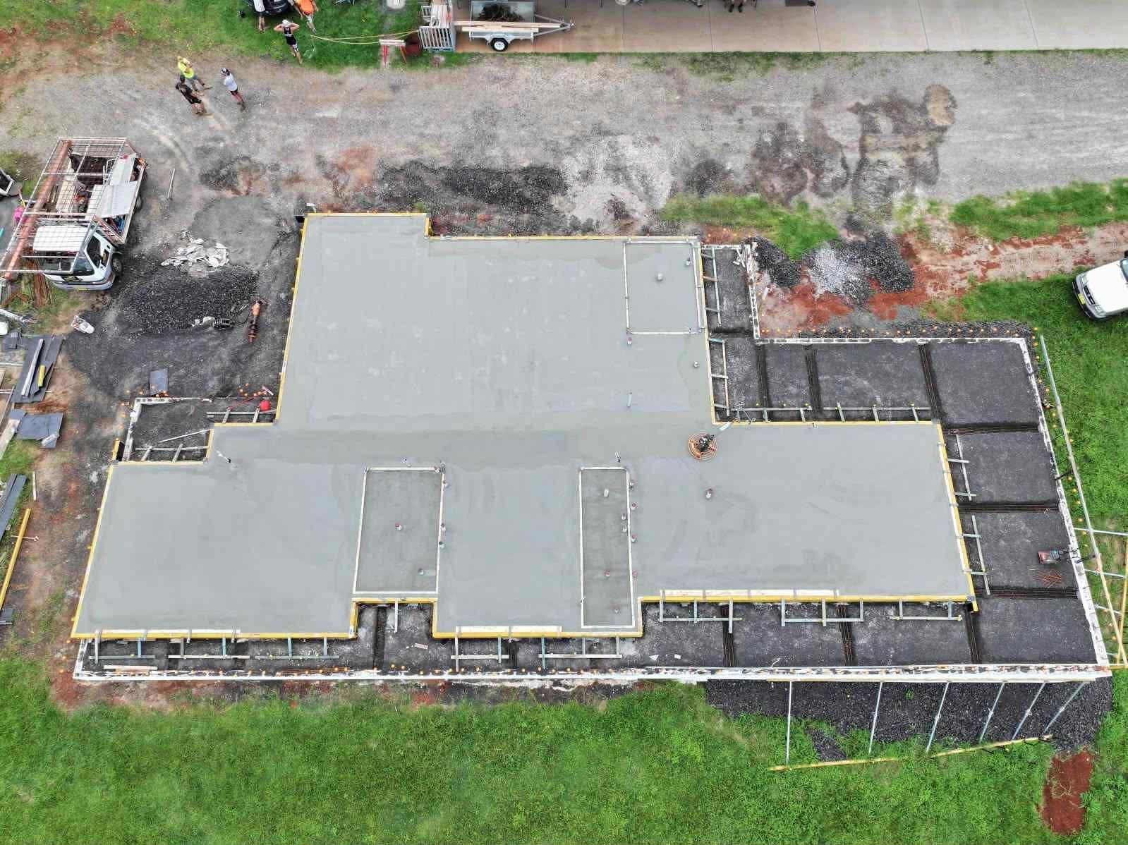 An aerial view of a concrete floor being built in a yard — ZBM Constructions in Wollongbar, NSW