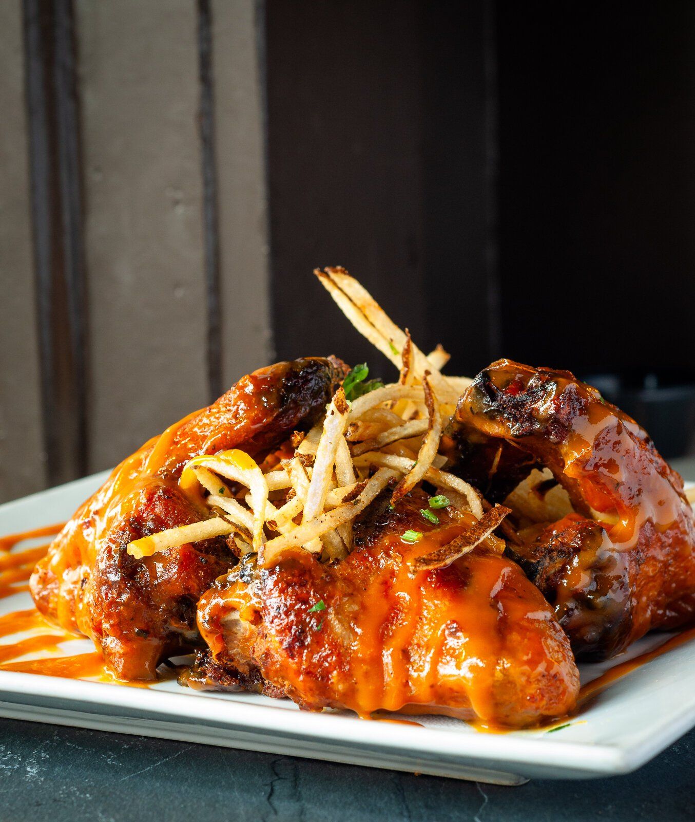 chicken wings and French fries at 1920 Tavern