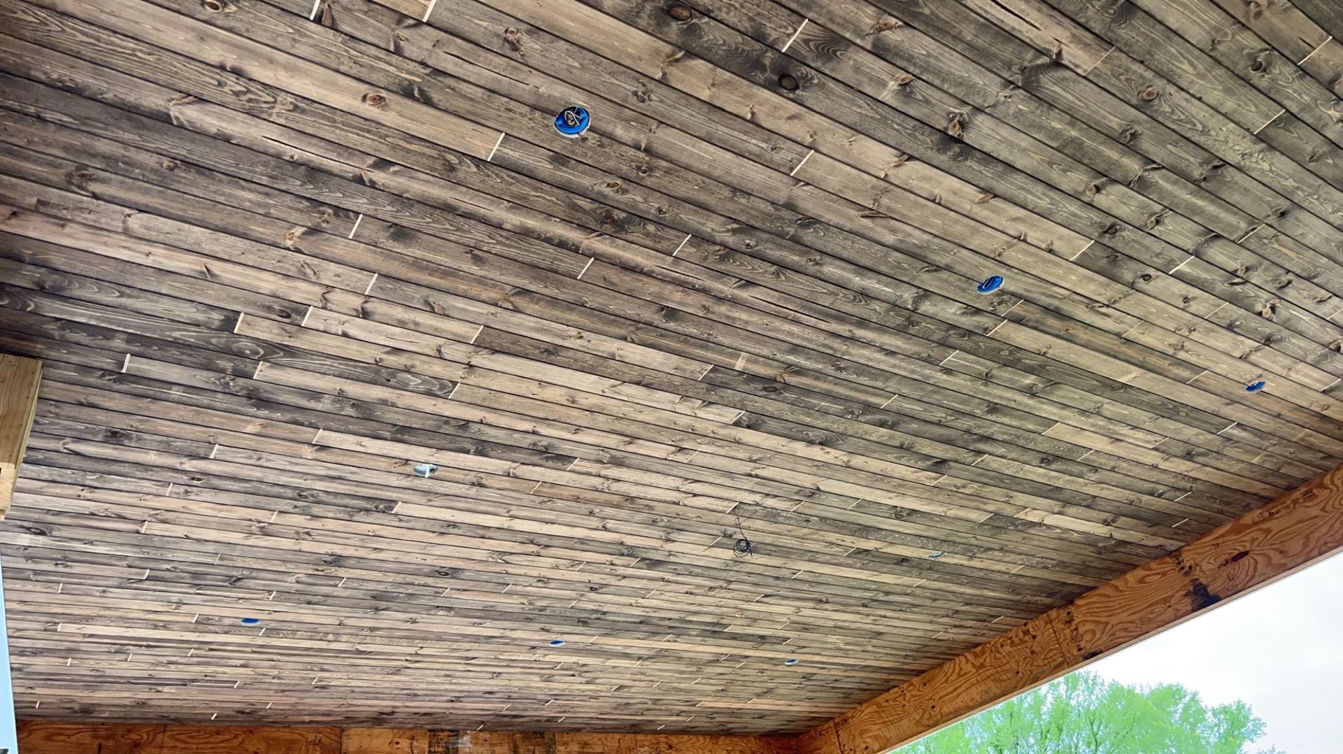 A close up of a wooden ceiling in a building.