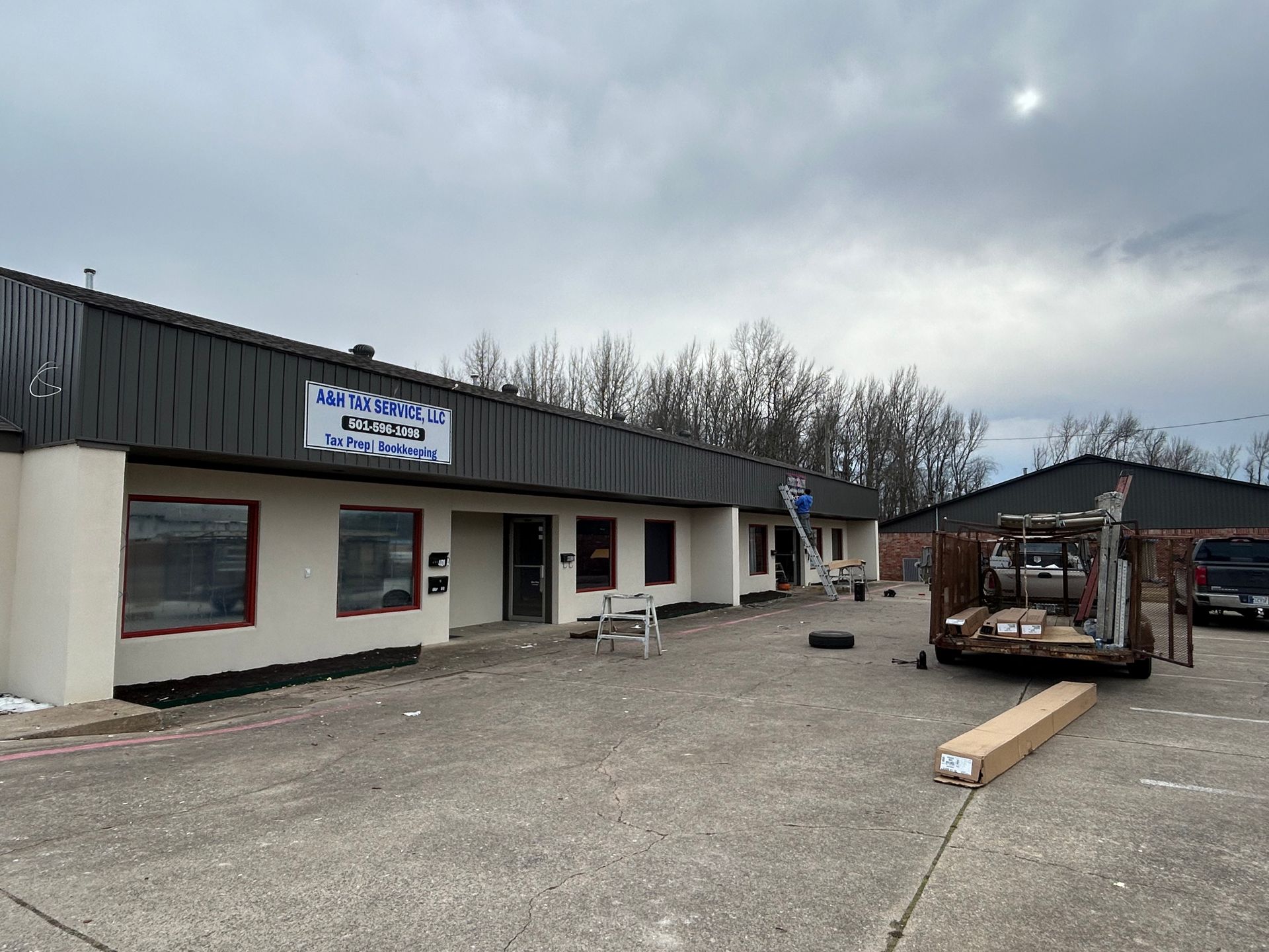A forklift is parked in front of a building.
