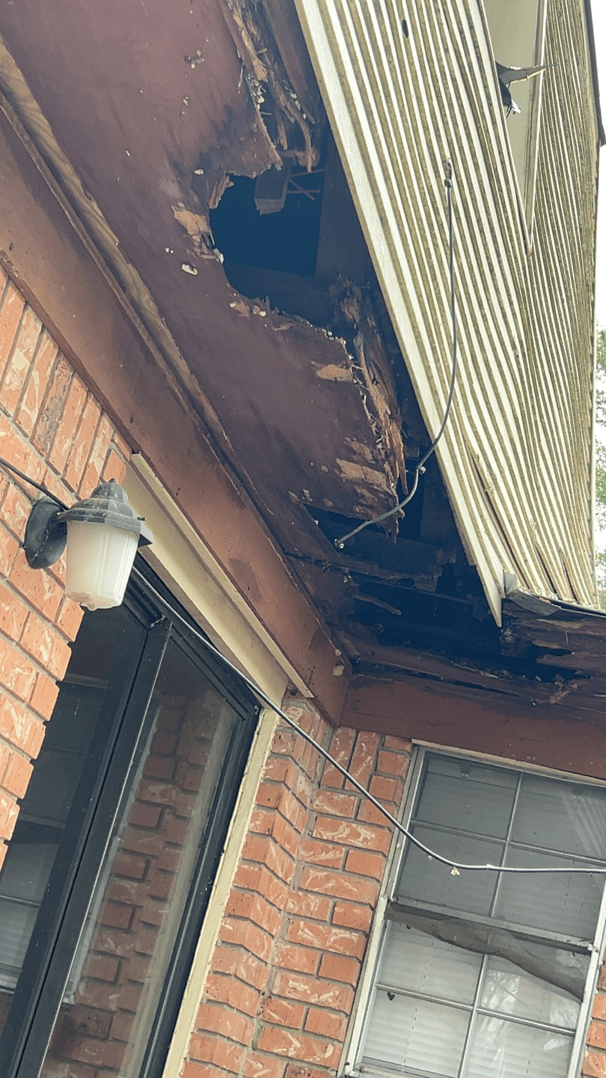 There is a hole in the roof of a building.