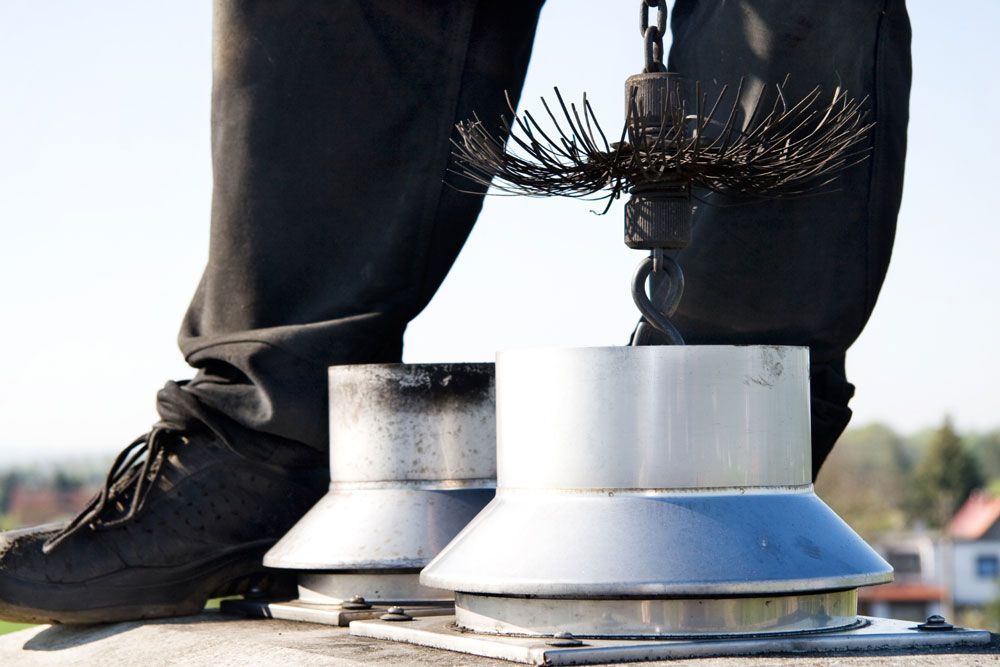 Man cleaning the chimney in Jacksonville, FL