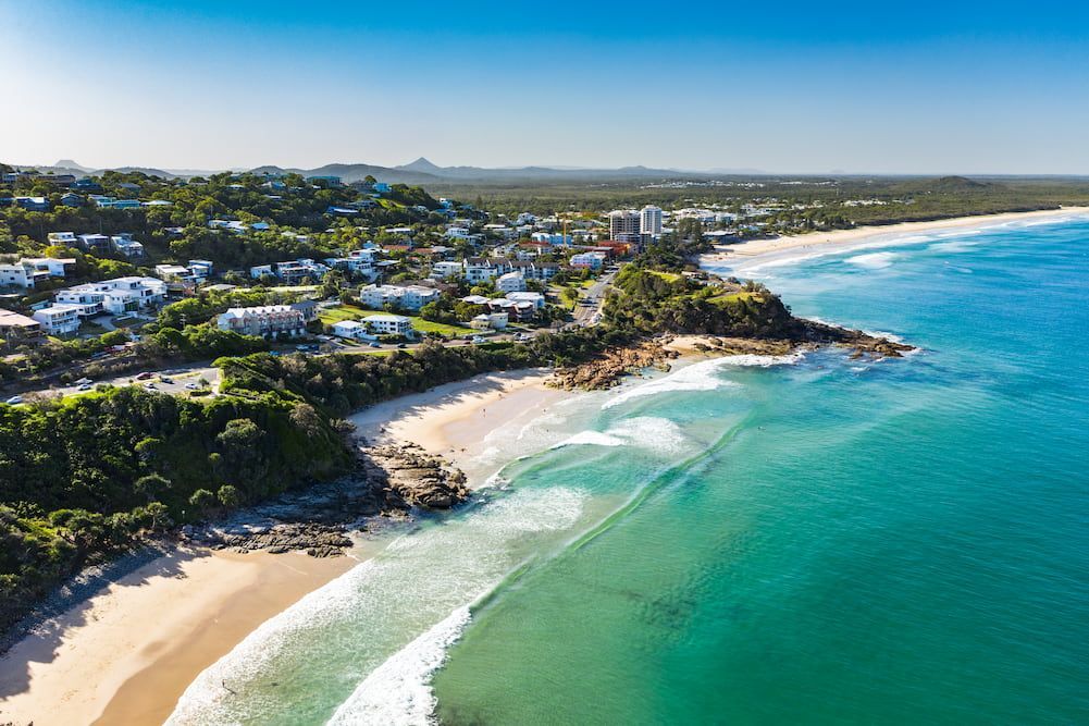 An Aerial View of A Beach with Waves Crashing on The Shore — Cape York Accounting Smithfield in Lockhart River, QLD