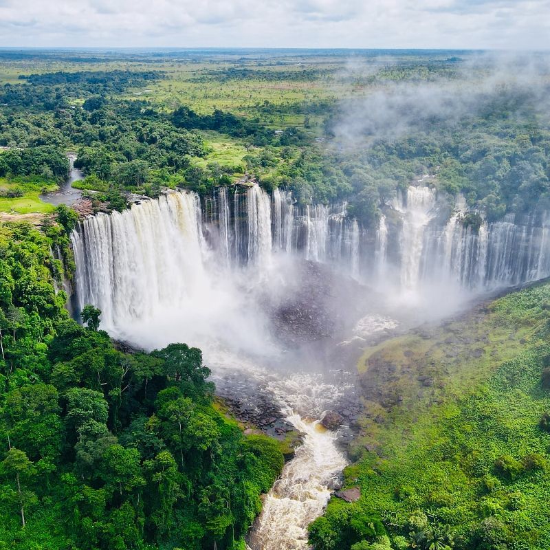 Aerial view of Kalandula Falls, one of Angola’s most impressive natural sights, where powerful waters plunge into deep gorges, sending mist into the air and surrounded by lush green forest. Located in northern Angola, this remote wonder is rarely visited, offering a unique experience far from the crowds. Inspiration Africa organizes tailor-made travel to Kalandula Falls and beyond, giving you access to Angola’s untouched landscapes and hidden highlights. Whether by road or air, we design expedition-style journeys in partnership with trusted local experts to help you explore Angola’s wild beauty in comfort and safety.