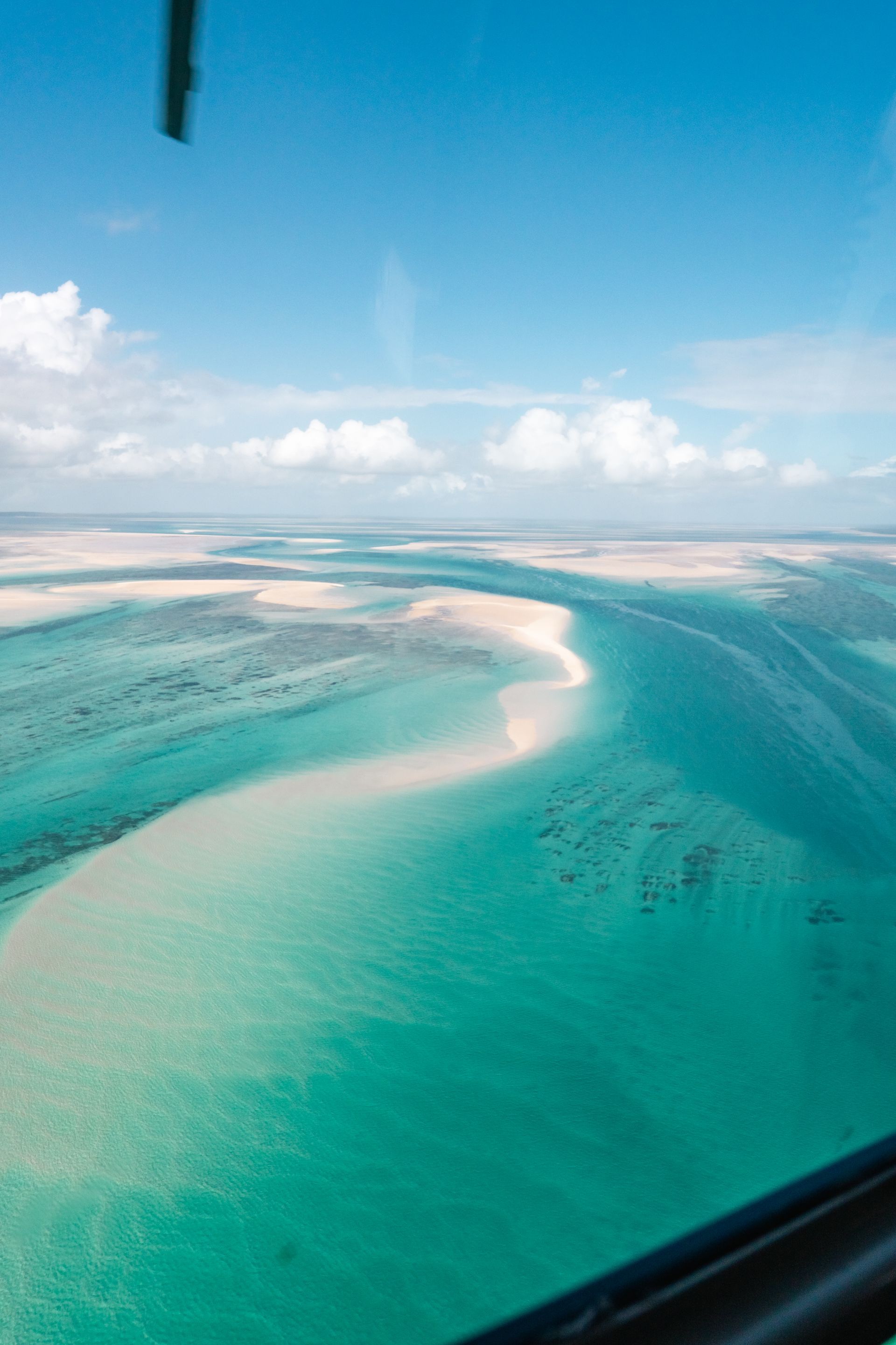 Experience the remote perfection of the Bazaruto Archipelago in Mozambique from the air. This magnificent aerial photo reveals pristine white sandbanks winding through the ocean, surrounded by dazzlingly clear turquoise water. Bazaruto is a true aquatic paradise for diving and relaxation. Inspiration Africa specializes in designing your luxurious, tailor-made trip to Mozambique's spectacular coast and other extraordinary destinations across Africa. Plan your dream beach holiday with us today!