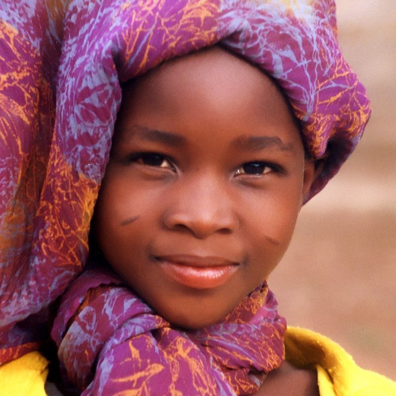 This striking image of a smiling child wearing a vibrant, colorful headdress captures the warmth and cultural richness of Burkina Faso. It reflects the country's strong community spirit and diverse traditions found across its villages and festivals. Inspiration Africa offers customized travel to Burkina Faso, connecting you with authentic local experiences, expert guides, and off-the-beaten-path encounters. From artisan markets to cultural celebrations, we design journeys that bring you closer to the heart of West Africa. Travel with Inspiration Africa to explore the beauty, resilience, and human connection that define Burkina Faso.