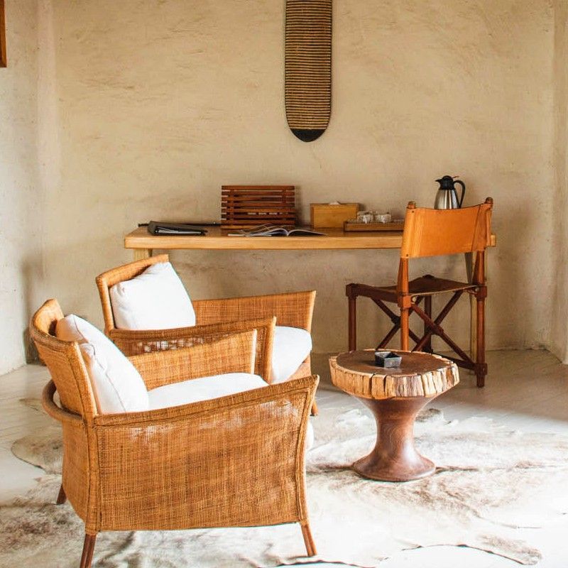 Witness the stunning convergence of elements in the Bazaruto Archipelago, Mozambique. This aerial view showcases a pristine, solitary strip of white sand, dramatically defined by the surrounding ocean. The water shifts beautifully, moving from brilliant, bright turquoise near the edge to a rich deep ocean blue further out. Inspiration Africa specializes in designing your exclusive, tailor-made trip to Mozambique's aquatic wonders and other spectacular destinations across Africa. Plan your private island escape with us!