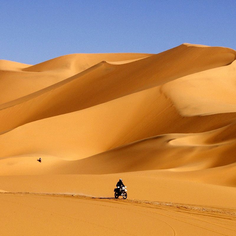 Discover the breathtaking beauty of the Sahara Desert in southern Algeria with Inspiration Africa. This powerful image of motorcycle riders in the vast dunes captures the spirit of adventure that awaits in one of the world’s most remote and majestic landscapes. Inspiration Africa specializes in organizing tailor-made travel experiences across the continent, and Algeria is no exception. Whether you're looking for a thrilling motorcycle journey or a guided desert expedition, we’ll help you explore the Sahara in comfort and style. Let us take you beyond the ordinary and into the heart of North Africa’s most awe-inspiring desert terrain.